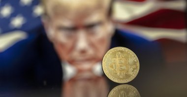 An illustration shows a Bitcoin mockup in front of an image of U.S. President-elect Donald Trump, Nov. 22, 2024. (EPA Photo)