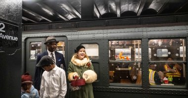 People participate in the annual vintage subway train ride in New York City, U.S., Dec. 8, 2024. (AFP Photo)