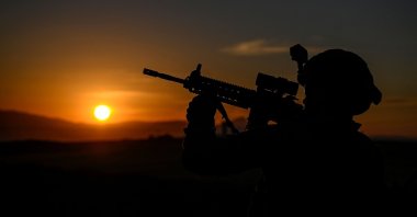 A Turkish soldier patrols near the border wall between Türkiye and Iran, Van, eastern Türkiye, Nov. 1, 2024. (AFP Photo)