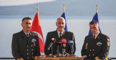  Naval Capt. Kürşat Kurnaz (left) assumes the command from Romania’s Capt. Sebastian Barote (right) with Rear Adm. Stefan Pauly Stefan Pauly (center), in Erdek, Dec. 16, 2024. (AA Photo)