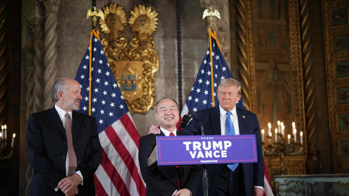 U.S. President-elect Donald Trump looks on as SoftBank CEO Masayoshi Son (C) speaks alongside Trump&#039;s choice for secretary of Commerce, Cantor Fitzgerald, and Chair and CEO Howard Lutnick, at Trump’s Mar-a-Lago resort, Palm Beach, Florida, U.S., Dec. 16, 2024. (AFP Photo)