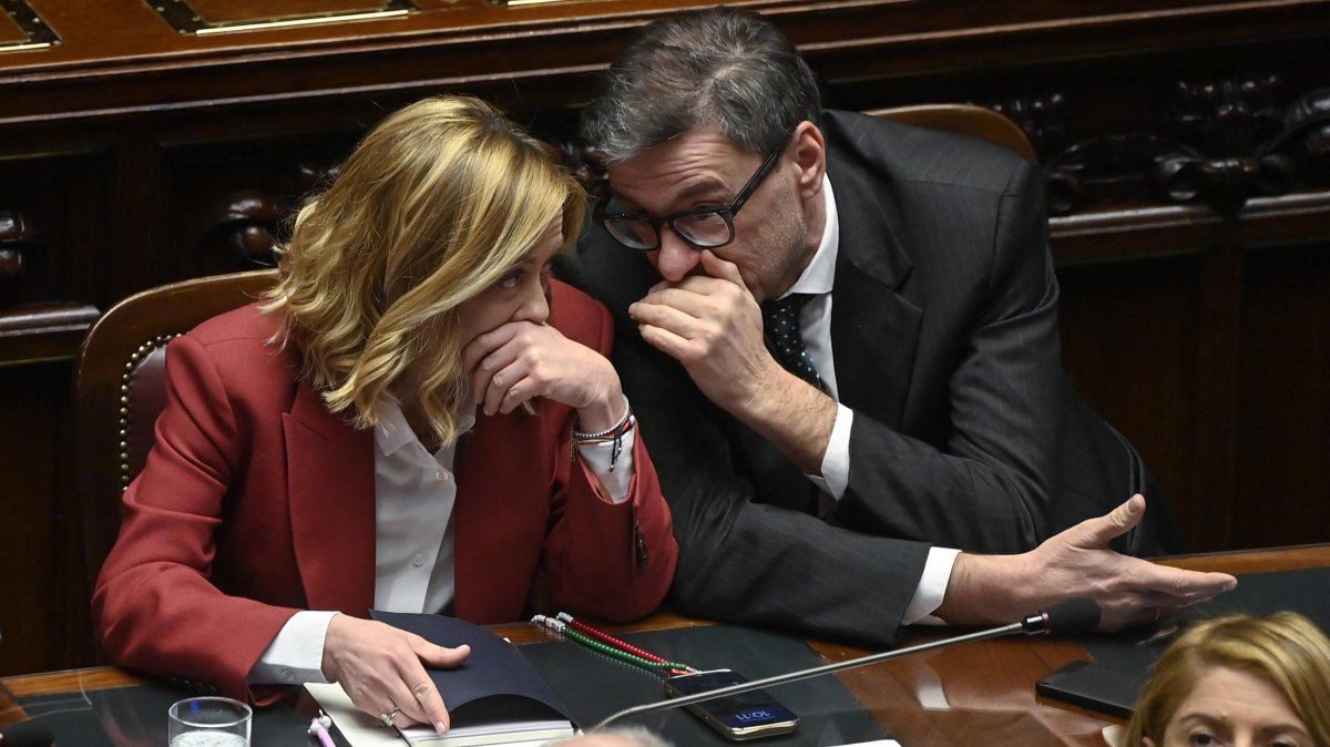 Italian Prime Minister Giorgia Meloni (L) speaks with Minister of Economy Giancarlo Giorgetti (R) as she reports at the Chamber of Deputies on the upcoming European Council in Rome, Italy, Dec. 17, 2024. (EPA Photo)