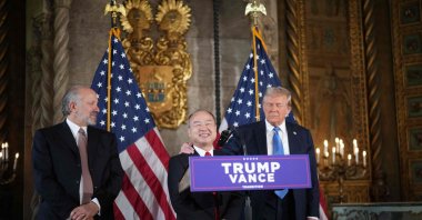 U.S. President-elect Donald Trump looks on as SoftBank CEO Masayoshi Son (C) speaks alongside Trump&#039;s choice for secretary of Commerce, Cantor Fitzgerald, and Chair and CEO Howard Lutnick, at Trump’s Mar-a-Lago resort, Palm Beach, Florida, U.S., Dec. 16, 2024. (AFP Photo)