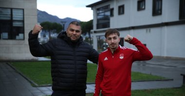Turkish weightlifter Yusuf Fehmi Genç (R) poses for a photo with Cumali Tekin after an interview with Anadolu Agency (AA), Ordu, Türkiye, Dec. 17, 2024. (AA Photo)