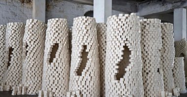 Stacks of soap waiting to be wrapped and packed are pictured at a local soap factory in the old city of Nablus, in the occupied West Bank, Palestine, Nov. 28, 2024. (AFP Photo)