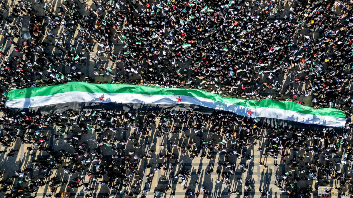 An aerial view of people gathering at Saadallah al-Jabiri Square to celebrate the ousting of regime despot Bashar Assad, Aleppo, Syria, Dec. 13, 2024. (AFP Photo)