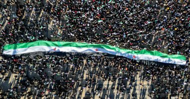 An aerial view of people gathering at Saadallah al-Jabiri Square to celebrate the ousting of regime despot Bashar Assad, Aleppo, Syria, Dec. 13, 2024. (AFP Photo)