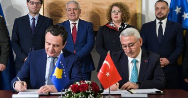 Kosovo&#039;s Prime Minister Albin Kurti (L) and MKE General Manager Ilhami Keleş sign an agreement to set up an ammunition facility, Prishtina, Kosovo, Dec. 16, 2024. (AA Photo)