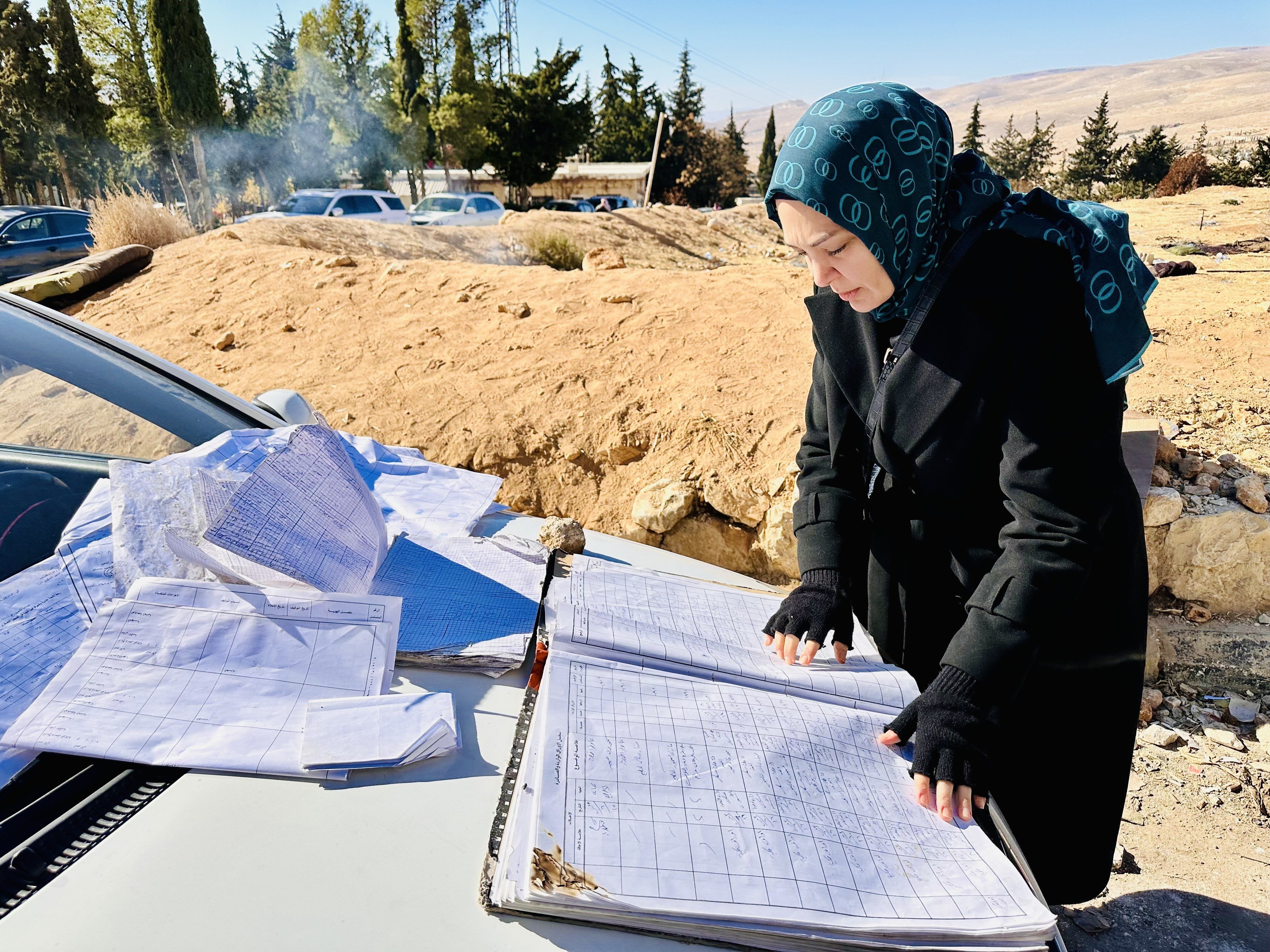 An undated photo of Daily Sabah columnist Hilal Kaplan examining the visitation book of the Sednaya prison, Syria. (Photo by Hilal Kaplan)