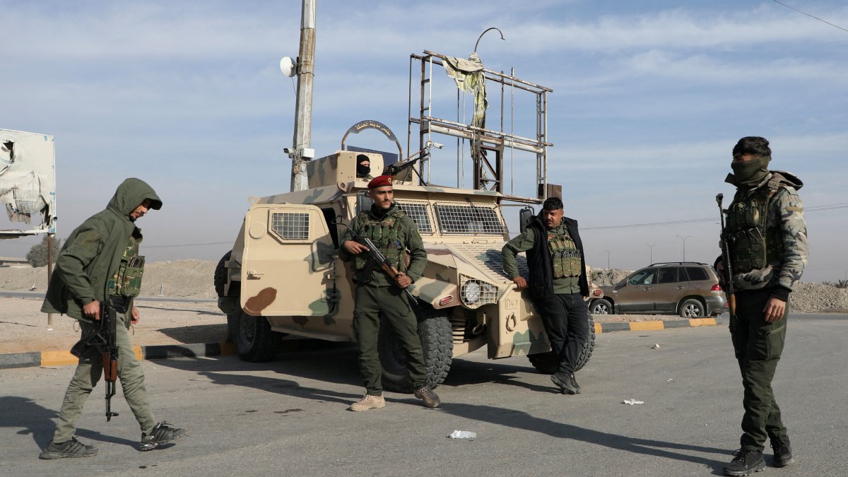 Members of the PKK/YPG terrorist group stand near a street, in Hassakeh, Syria, Dec. 11, 2024. (Reuters Photo)