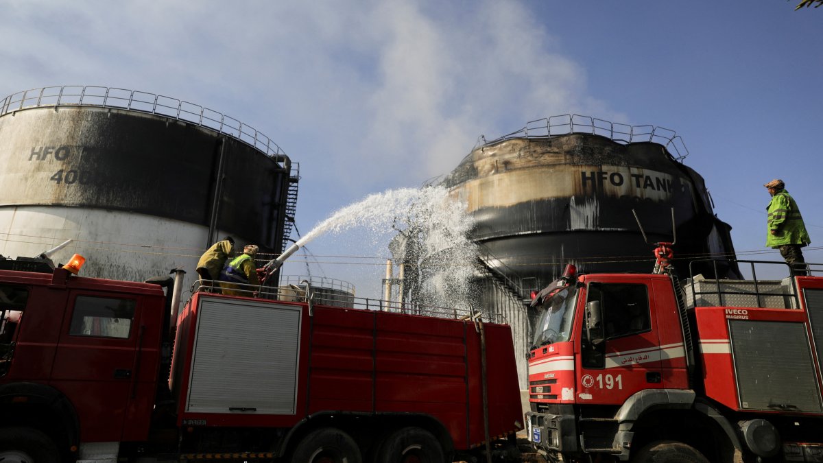 Emergency workers extinguish a fire at a power station following Israeli airstrikes in Sanaa, Yemen, Dec. 19, 2024. (Reuters Photo)