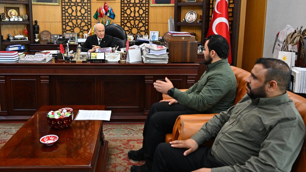 MHP leader Devlet Bahçeli (L) talks with Seyf Ebubekir Polat (2nd R) and Muhammet Casim (R) in the capital, Ankara, Türkiye, Dec. 18, 2024. (AA Photo)