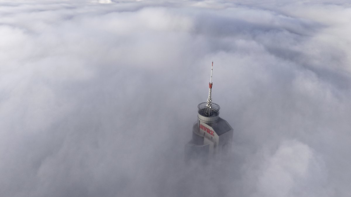 Avaz Twist Tower building, 172 meters high, peaks through a dense layer of fog and smog in Sarajevo, Bosnia-Herzegovina, Dec. 19, 2024. (AP Photo)