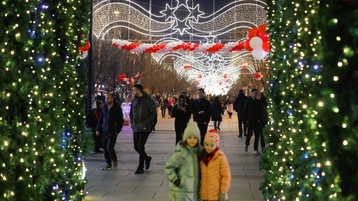 People gather during the holiday season in Mother Teresa Square in Pristina, Kosovo, Dec. 18, 2024. (Reuters Photo)