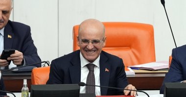 Treasury and Finance Minister Mehmet Şimşek speaks at Parliament during 2025 budget talks, Ankara, Türkiye, Dec. 16, 2024. (AA Photo)