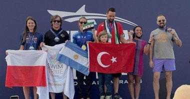 An undated picture of Syrian-born swimmer Muhammed Naim Mısıroğlu at the podium. (AA Photo)