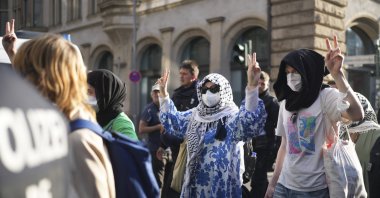 Pro-Palestinian demonstrators who show the victory sign are escorted by police as they leave a building of  the Humboldt University in Berlin, Germany, Thursday, May 23, 2024. (AP File Photo)