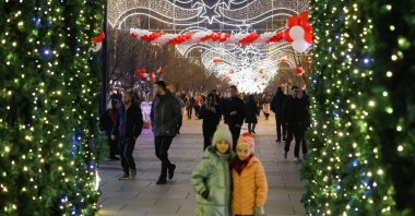 People gather during the holiday season in Mother Teresa Square in Pristina, Kosovo, Dec. 18, 2024. (Reuters Photo)