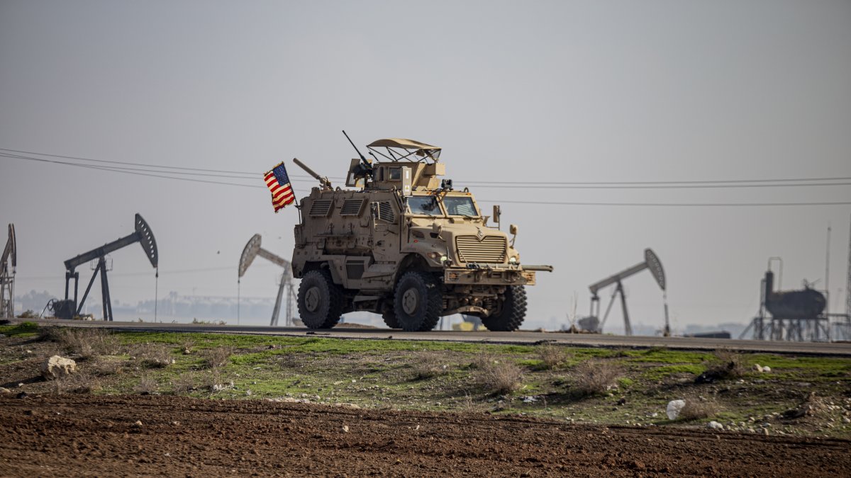 A U.S. military vehicle on patrol in the countryside near the town of Qamishli, Syria, Sunday, Dec. 4, 2022. (AP File Photo)