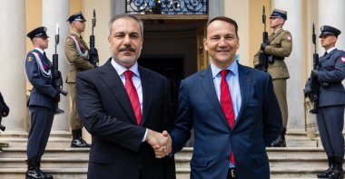Foreign Minister Hakan Fidan (L) and Polish Foreign Minister Radoslaw Sikorski shake hands before a meeting in Helenow, central Poland, June 26, 2024. (IHA Photo)