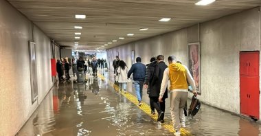Pedestrians wade through a flooded underpass at Ulubatlı Metro Station, Istanbul, Türkiye, Dec. 20, 2024. (AA Photo) 