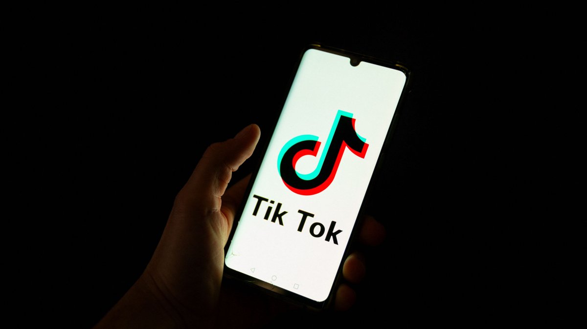 A man holds a smartphone displaying the logo of the Chinese social media platform Tiktok, Paris, France, April 19, 2024. (AFP Photo)