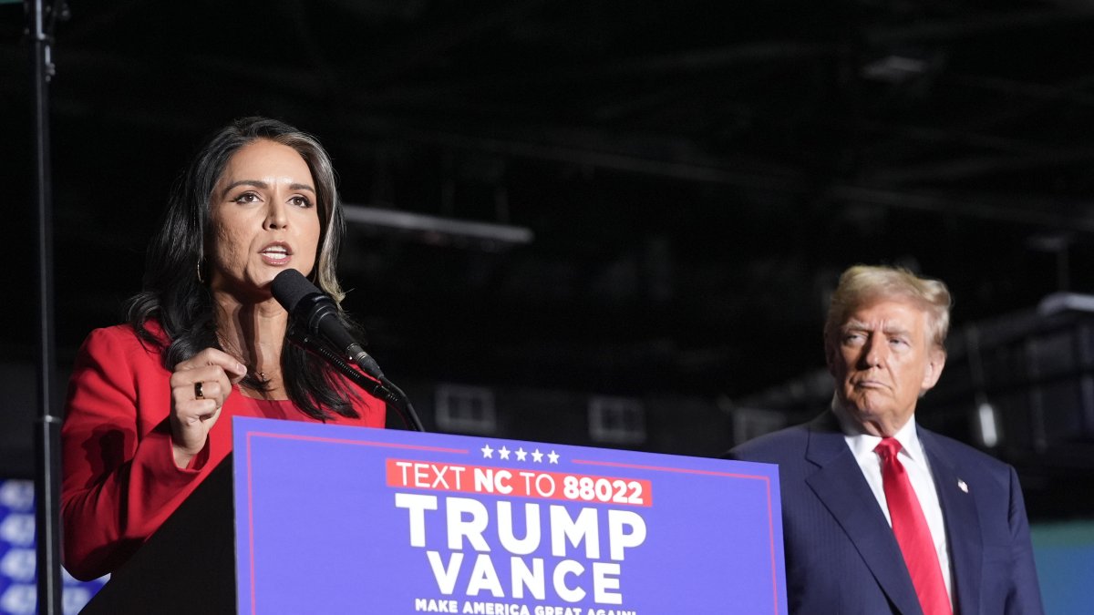 Former Democratic Representative Tulsi Gabbard speaks as Republican presidential nominee Donald Trump listens during a campaign rally, Greensboro, North Carolina, U.S., Oct. 22, 2024. (AP Photo)