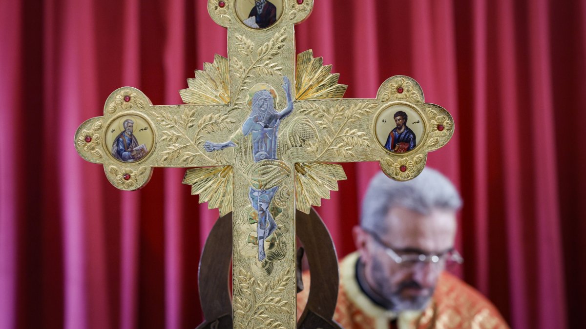 A priest leads a mass in a church in Maaloula, where Aramaic is still spoken and is one of the earliest centers of Christianity in the world, 55 kilometers (34.18 miles) from Damascus, Syria, Dec. 15, 2024. (EPA Photo)