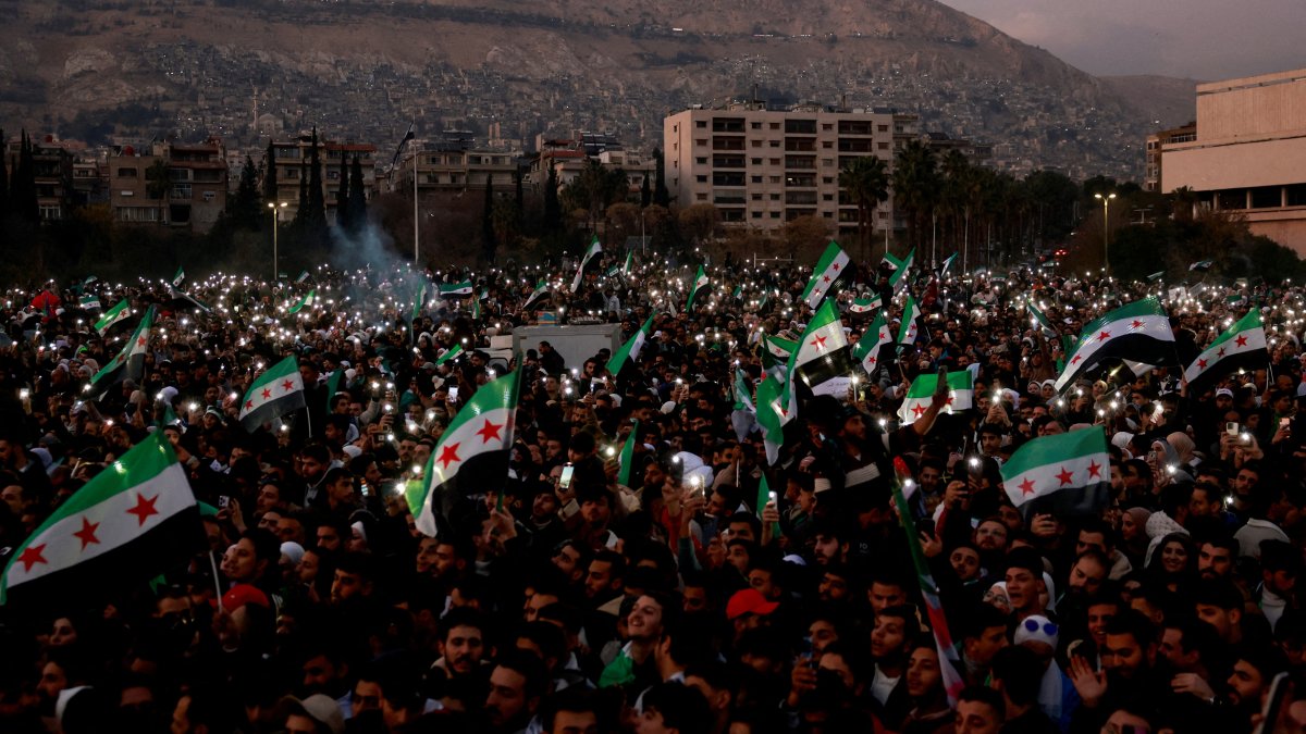 People gather during a celebration over the fall of the Assad regime, in Damascus, Syria, Dec. 20, 2024. (Reuters Photo)