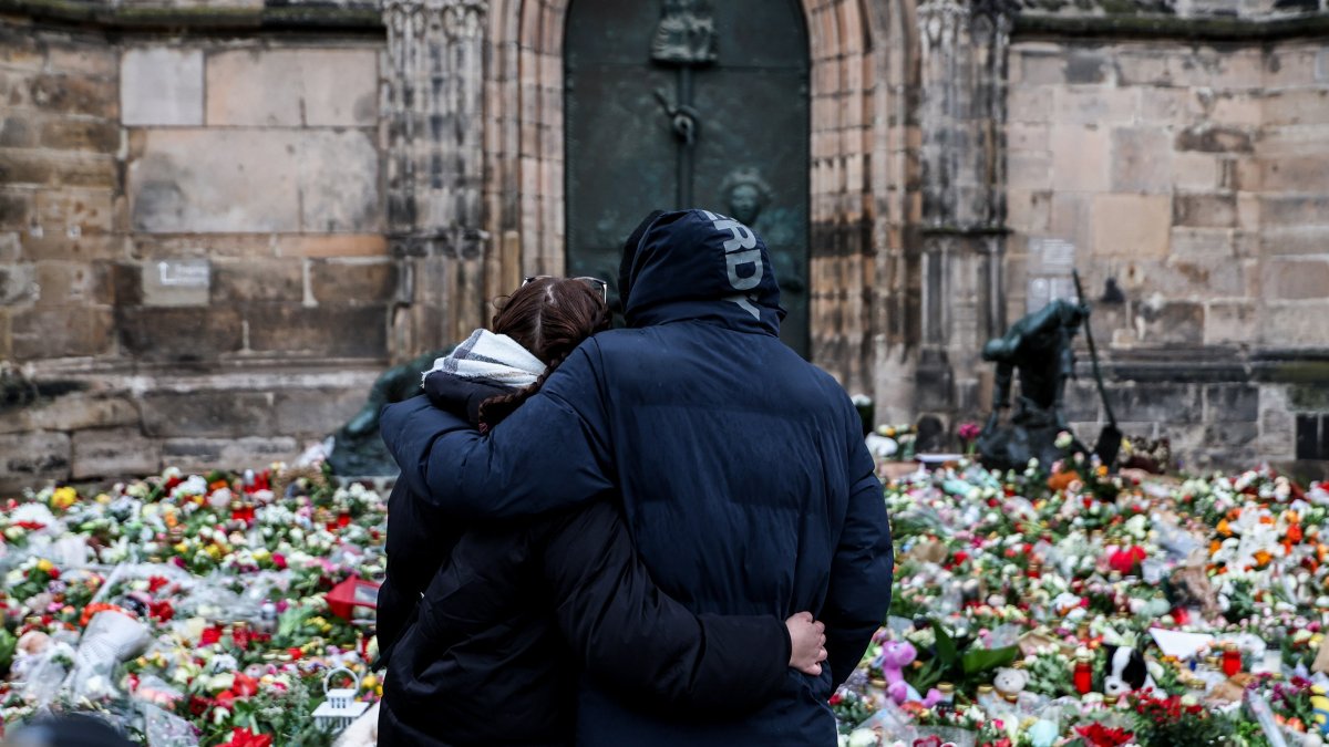 People mourn at the mourning site in front of St. John&#039;s Church following a vehicle-ramming attack in Magdeburg, Germany, Dec. 22, 2024. (EPA Photo)