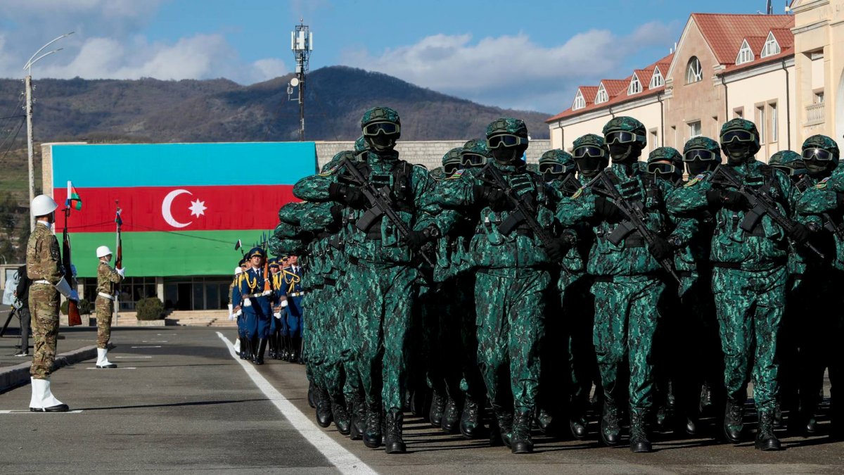 In this photo provided by Azerbaijan&#039;s Presidential Press Office, troops march past Azerbaijani President Ilham Aliyev during a parade dedicated to the third anniversary of the Victory in the Patriotic War in Khankendi, Khankendi, Azerbaijan, Nov. 8, 2023. (AP Photo)