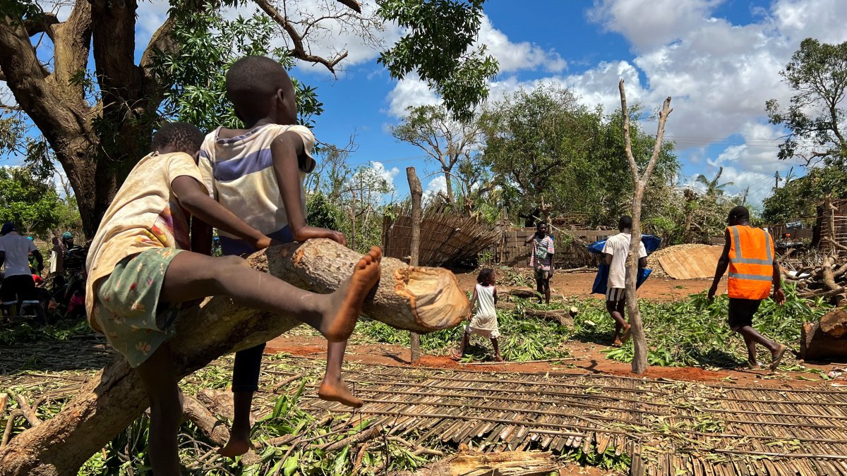 Residents affected following cyclone Chido walk around their home in Pemba, Mozambique, December 18, 2024. REUTERS/Shafiek Tassiem