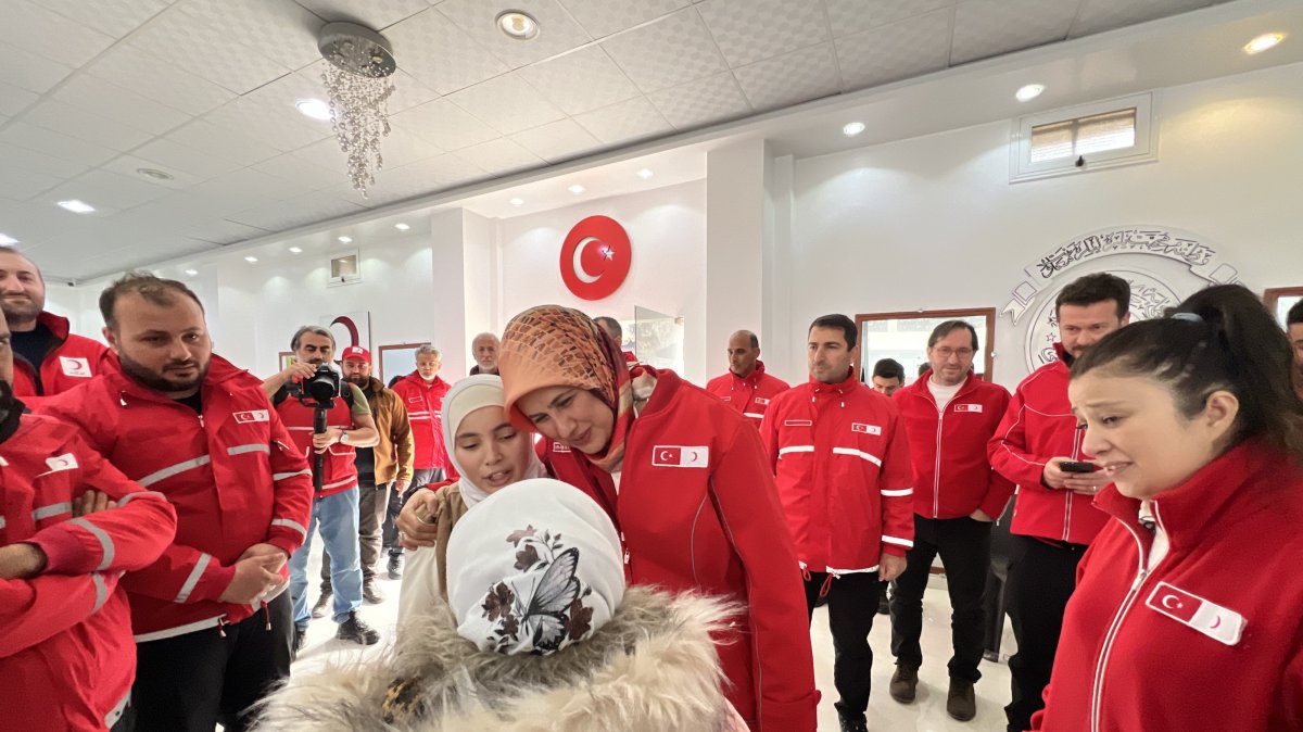 Fatma Meriç Yılmaz meets with children during her visit to the Turkish Red Crescent bakery and logistics center in Idlib, Syria, Dec. 22, 2024. (AA Photo)