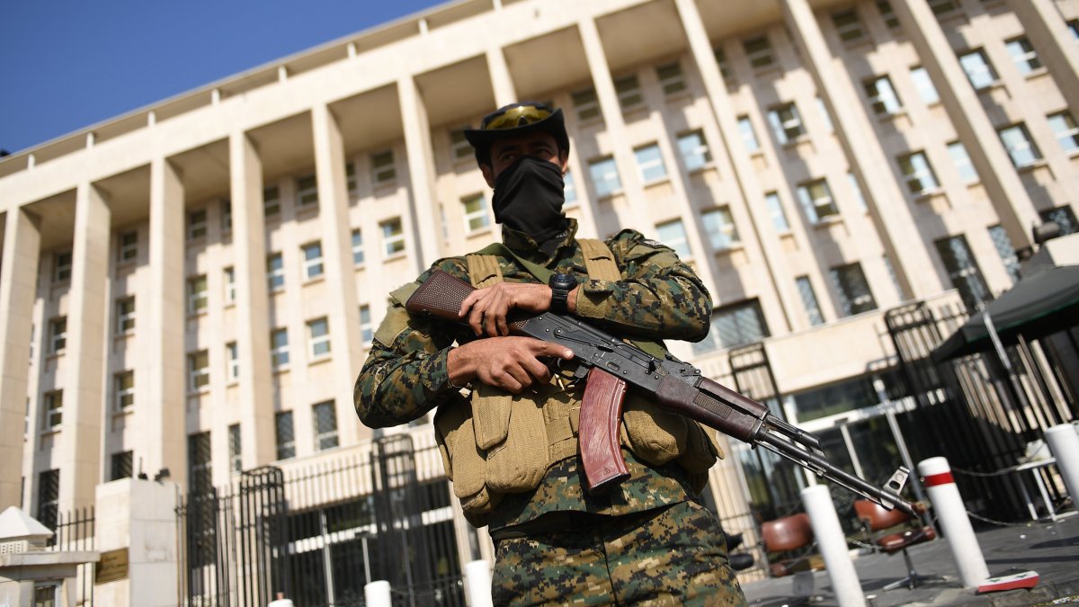 An armed guard seen standing on the streets of Damascus, Syria, Dec. 9, 2024. (EPA Photo)