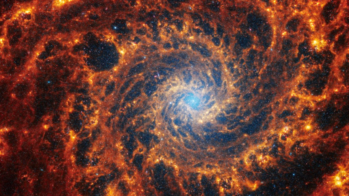 Spiral galaxy NGC 628, located 32 million light-years away from Earth, is seen in an undated image from the James Webb Space Telescope. (Reuters Photo)