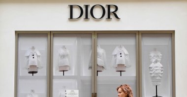 A woman walks past a closed Dior boutique at the GUM department store in downtown Moscow, Russia, May 27, 2022. (AFP File Photo)