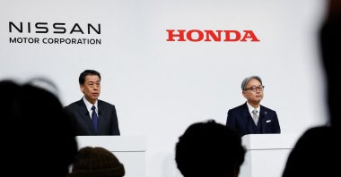 Nissan CEO Makoto Uchida and Toshihiro Mibe, president of Honda, along with Takao Kato, CEO of Mitsubishi Motors (not pictured), hold a joint press conference on their merger talks, Tokyo, Japan, Dec. 23, 2024. (Reuters Photo)