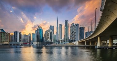 Sunset over the skyline of the United Arab Emirates, with clouds above the skyscrapers. (Shutterstock Photo)