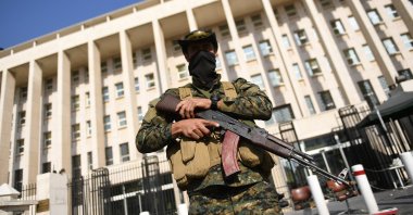 An armed guard seen standing on the streets of Damascus, Syria, Dec. 9, 2024. (EPA Photo)