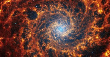 Spiral galaxy NGC 628, located 32 million light-years away from Earth, is seen in an undated image from the James Webb Space Telescope. (Reuters Photo)