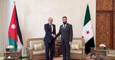  Jordan&#039;s Foreign Minister Ayman Safadi (Left) and Syria&#039;s new leader Ahmed al-Sharaa (also known as Abu Mohammad al-Jolani) shake hands in Damascus, Dec. 23, 2024. (Photo by Jordanian Foreign Ministry / AFP)