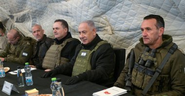 Israeli Prime Minister Benjamin Netanyahu (C-R) and Defense Minister Israel Katz (C-L), sitting between army Chief-of-Staff Herzi Halevi (R) and Israel&#039;s Chief of the Mossad David Barnea (2nd L), at Mount Hermon in the annexed Golan Heights, Dec. 17, 2024. (AFP Photo - Handout)