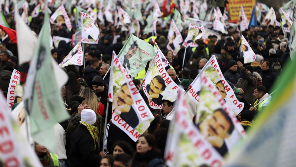 PKK terrorist sympathizers wave posters of the terrorist group&#039;s leader, Abdullah Öcalan, during their rally, Cologne, Germany, Nov. 16, 2024. (AP Photo)