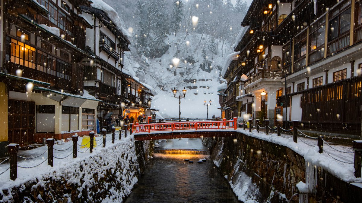 A scenic winter view of the historic hot spring accommodations beautifully illuminated in the evening at Ginzan Onsen, Yamagata, Japan, Jan. 30, 2019. (Shutterstock Photo)