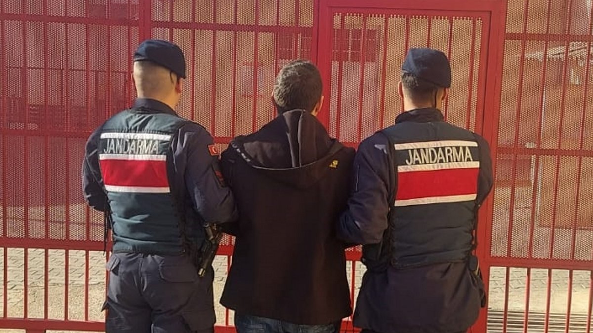 Gendarmerie officers detain a former lieutenant wanted for his links to FETÖ, in western Aydın province, Türkiye, Dec. 21, 2024. (AA Photo)