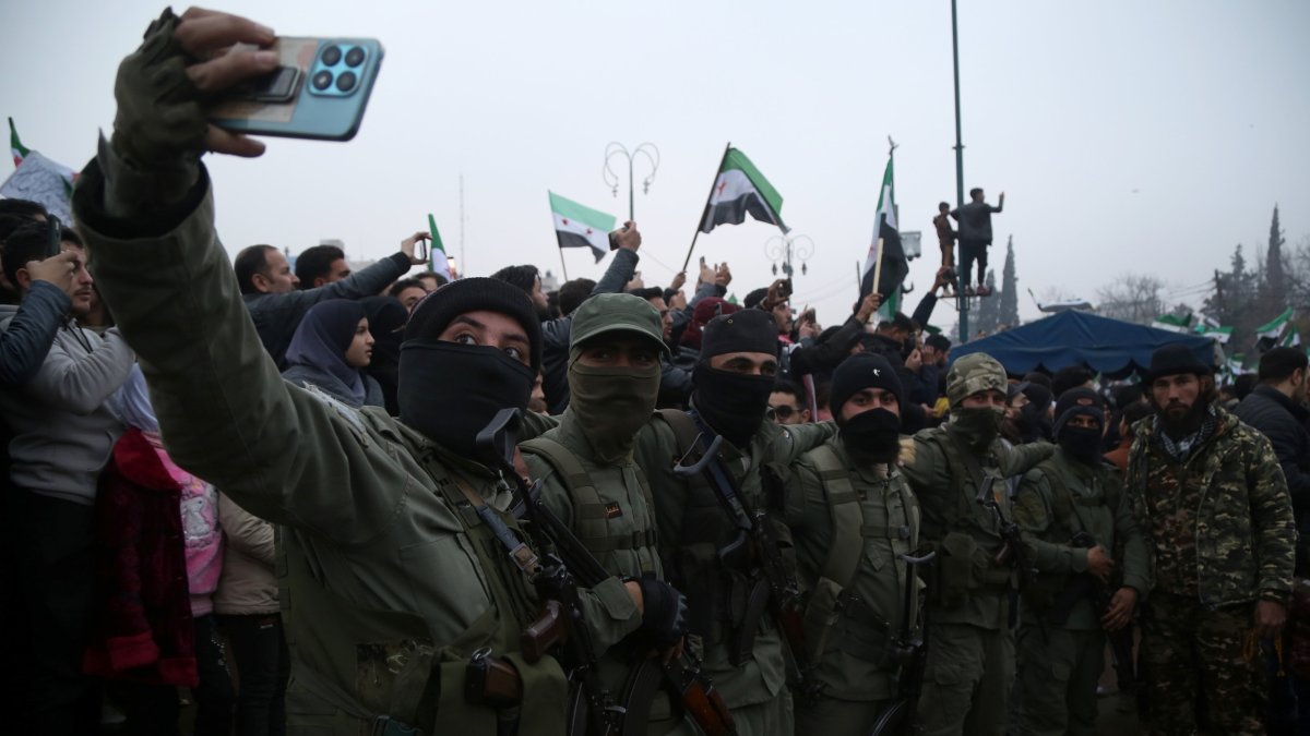 Members of an anti-regime group pose for a selfie in Idlib, northwestern Syria, Dec. 22, 2024. (EPA Photo)