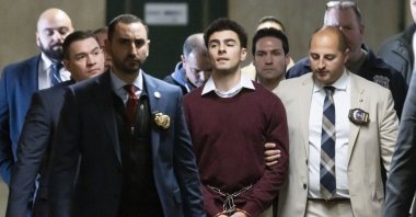 Luigi Mangione (C) is escorted by police officers following a hearing at New York State Supreme Court on murder charges, in New York, U.S., Dec. 23, 2024. (EPA Photo)