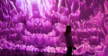 A visitor explores the exhibition in New York, U.S., Dec. 18, 2024. (Photo by Funda Karayel)