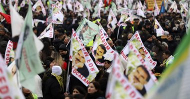 PKK terrorist sympathizers wave posters of the terrorist group&#039;s leader, Abdullah Öcalan, during their rally, Cologne, Germany, Nov. 16, 2024. (AP Photo)