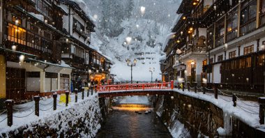A scenic winter view of the historic hot spring accommodations beautifully illuminated in the evening at Ginzan Onsen, Yamagata, Japan, Jan. 30, 2019. (Shutterstock Photo)